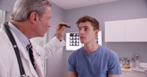 man being examined by a doctor