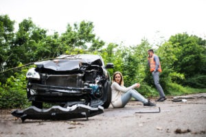 a woman and a man calling for help after a head-on collision