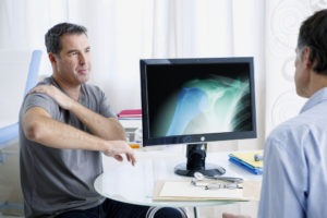 patient learning from doctor that he needs orthopedic surgery